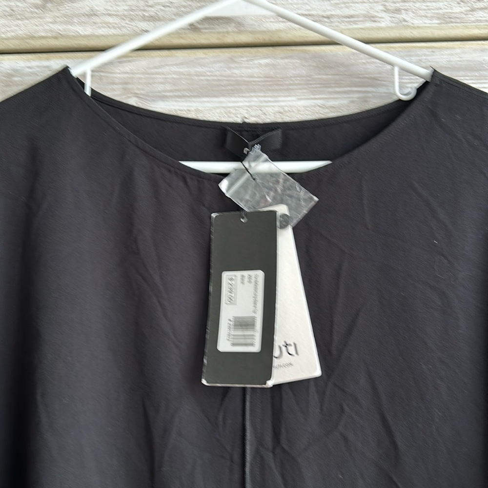 Elegant Black Blouse by [Brand]